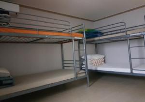 Postel nebo postele na pokoji v ubytování K Guesthouse