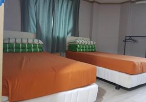 Postel nebo postele na pokoji v ubytování K Guesthouse