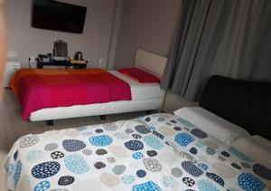 Postel nebo postele na pokoji v ubytování K Guesthouse