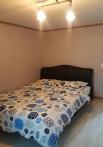 Postel nebo postele na pokoji v ubytování K Guesthouse