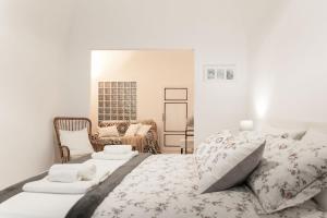 Säng eller sängar i ett rum på Ricciarelli Home