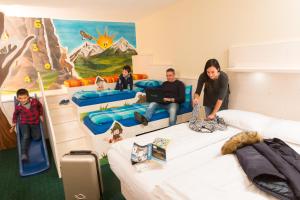 Postel nebo postele na pokoji v ubytování Hotel Touring