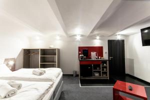 Postel nebo postele na pokoji v ubytování SILESIA Residence