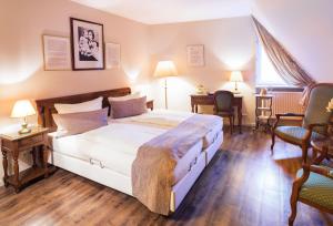 Säng eller sängar i ett rum på TOP CityLine Klassik Altstadt Hotel Lübeck
