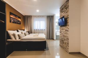 TV a/nebo společenská místnost v ubytování SILESIA Residence