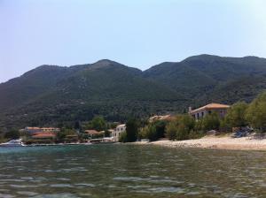 a view of a river with mountains in the background at Lefkada Beachfront Apartment in Nikiana