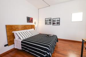 A bed or beds in a room at Travel B&B