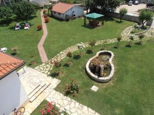 an aerial view of a garden with a fountain at Villa Linet Garden in Funtana