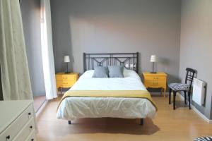 Postel nebo postele na pokoji v ubytování Hostal San Martin