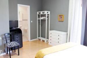 Postel nebo postele na pokoji v ubytování Hostal San Martin