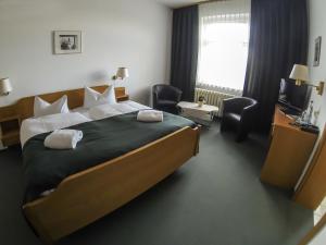 Postel nebo postele na pokoji v ubytování Central-Hotel Torgau