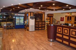 a room with a bar and a drink machine at Badova residential units in Al Khobar