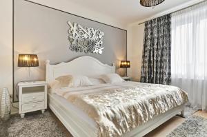 ウェルネス ＆ スパ ブティック ホテル ポト リプカミ プラハにあるベッド