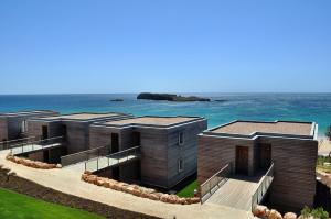 a row of modular homes overlooking the ocean at Martinhal Sagres Beach Family Resort Hotel in Sagres