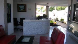 a living room with a bar in the middle of a room at Desarrollo Turistico in Oaxtepec