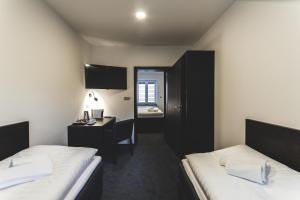 Postel nebo postele na pokoji v ubytování SILESIA Residence