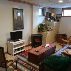 a living room with a couch and a fireplace at Cricket Hill in Killington