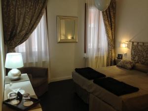 Cama ou camas em um quarto em Albergo Marin