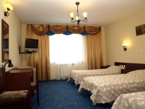 Кровать или кровати в номере Hotel Relaks