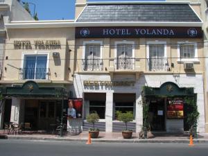 a hotel yolanda on a city street with a building at Cordoba Yolanda Hotel in Córdoba