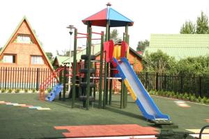 a playground with several slides and slidesktop at Apartamenty w Stegnie in Stegna