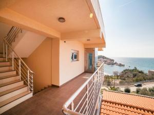 a balcony of a house with a view of the ocean at Apartments Raymond in Sveti Stefan