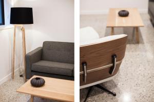 a living room with a chair and a table with a lamp at Dungarvon Street Apartments in Wanaka