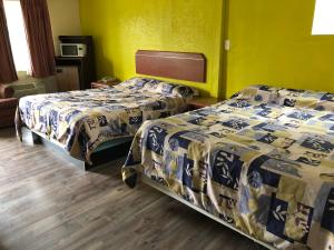 Postel nebo postele na pokoji v ubytování Budget inn