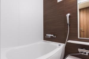 Koupelna v ubytování Dormy Inn EXPRESS Sendai Seaside