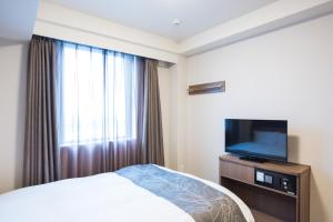 TV a/nebo společenská místnost v ubytování Dormy Inn EXPRESS Sendai Seaside
