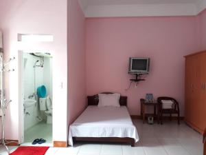 Postel nebo postele na pokoji v ubytování Khách sạn Hưng Vân - Bắc Kạn city