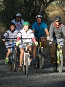a group of people riding bikes down a road at Glenfield Cottage in Yarck