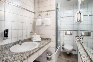 Koupelna v ubytování Home Hotel