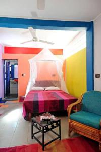 מיטה או מיטות בחדר ב-Maison d'hôtes Chez Giuliana