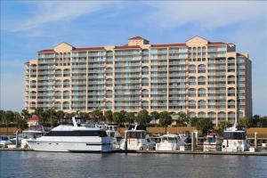 a large building with boats docked in a marina at 207 North Tower Condo in Myrtle Beach