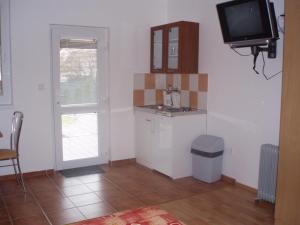 Kuchyňa alebo kuchynka v ubytovaní Apartmany u Smreka