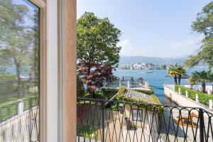 a balcony with a view of the water at B&B Al Dom in Orta San Giulio