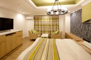 TV o dispositivi per l'intrattenimento presso Hotel Sunset (Adult Only)