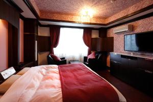 Letto o letti in una camera di Hotel Sunset (Adult Only)