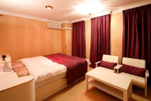 Letto o letti in una camera di Hotel Sunset (Adult Only)