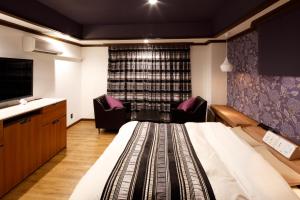 Letto o letti in una camera di Hotel Sunset (Adult Only)