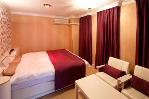 Letto o letti in una camera di Hotel Sunset (Adult Only)