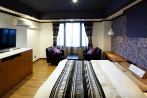 TV o dispositivi per l'intrattenimento presso Hotel Sunset (Adult Only)