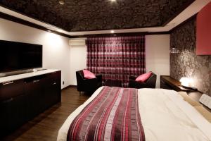 Letto o letti in una camera di Hotel Sunset (Adult Only)