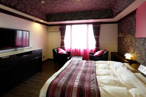 Letto o letti in una camera di Hotel Sunset (Adult Only)
