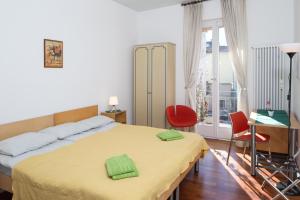 Postel nebo postele na pokoji v ubytování Rooms Al Festival