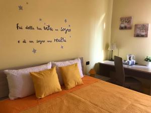 A bed or beds in a room at Color House Malpensa B&B