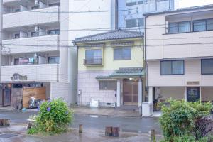 an empty street in front of a building at Hiroshima Danbara LiBPLUS in Hiroshima