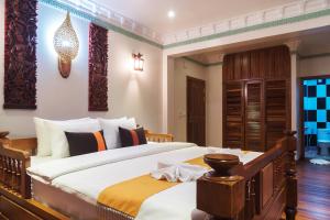Postel nebo postele na pokoji v ubytování Hello Cambodia Boutique