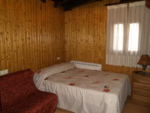 Posteľ alebo postele v izbe v ubytovaní Hostal Tribal